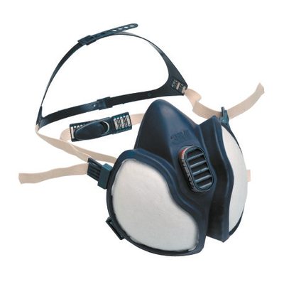 A reusable half-face respirator with filter cartridges.