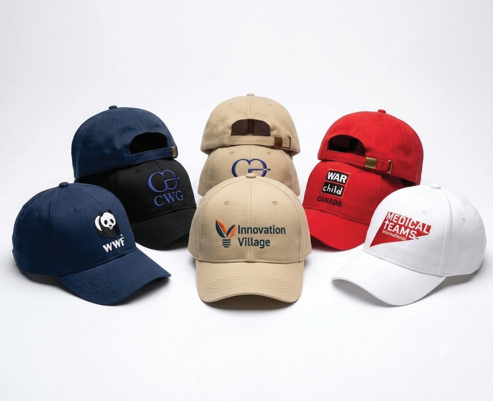 Branded caps in several colourways, embroidered with organisational marks.